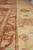 Guard stripes and main border shown close, burgundy inner band beside cream floral outer band