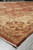 Side view of the rug edge with ivory border, sage accents and neatly finished selvage