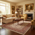 Cream living room with ivory and red Persian rug under wooden coffee table by fireplace