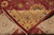 Folded corner revealing the tight hand-knotted back and dense silky wool pile of this Chobi rug