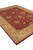 8'9" x 11'4" Ghazni wool rug photographed at an angle, burgundy field with sage green vinework