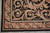 Corner of the black Aubusson rug where the acanthus field meets the rose and leaf border