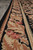 Floral border close-up with cabbage roses, camel leaves and a scalloped ivory outer guard stripe
