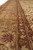 Close perspective of multiple guard borders with ivory floral vines and deep burgundy outlines