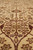 Detail of ivory field lattice with gold rosettes and diamond trellis in soft wool pile