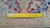 Ruler laid on the rug back showing the even wool weave and knots per square inch