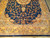 Half view of navy field with gold palmettes, corner spandrels and five band floral border
