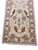 End panel of the 25 foot runner showing burgundy palmette, floral border and finished selvage