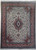 Ivory field Persian Tabriz rug with coral floral border and navy center medallion, full view