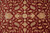 Detail of Zigler pattern rosettes, ivory blossoms and soft green leaves on deep burgundy wool