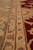 Angled border detail with paisley guard stripe, sage main border and salmon floral accents