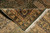 8x10 Indian wool rug folded back to reveal tight weave and cotton foundation