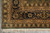 Corner detail with green selvedge, multiple borders in gold and navy, plus knotted ivory fringe