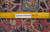 Reverse of the rug with a ruler laid across eight inches over the visible knot rows
