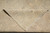 Corner of the rug folded back to show the even hand-knotted foundation and clear reverse pattern