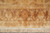 End border square on, large cream rosettes flanking a central oval cartouche in brown