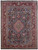 9'9 x 12'10 Persian Kashmar rug shown flat, navy floral field framed by red vase border