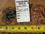 Back of the rug with tag reading rug number 6346, size 9.7 x 14.4, beside ruler