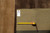 Back of rug with hand woven Oriental rug tag and tape measure confirming 12 foot width