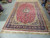 Red and blue Persian Najafabad rug shown lengthwise, ideal for large dining rooms and great rooms