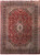 Rose red Persian Kashan rug measuring 9'10" x 13'2" with navy floral medallion and ivory spandrels