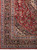 Corner detail showing layered guard borders, ivory spandrel flowers and the original white fringe