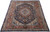 8'1" x 11'2" Persian Kashmar rug photographed at an angle showing navy field and rust border