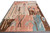 11'11" x 18'6" oversize Moroccan rug photographed at an angle showing patchwork rose and blue blocks
