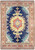Navy blue Persian Ardebil rug with gold medallion and sunset orange border, full overhead view
