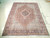 6'5" x 8'7" Persian Bijar rug on floor showing ivory spandrels and rose red field