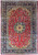 9'11" x 14'9" Persian Isfahan design rug with red field and navy floral border