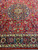 9'7" x 12'8" Persian rug medallion and lower navy border with paisley palmettes and ivory guards