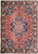 Rust and navy Persian Bakhtiari rug with star medallion, ivory vine outlines and floral border