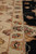 Ivory main border and narrow guard stripes detailed with rust, pink and pale blue flowerheads