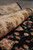 Rolled edge of the 8x10 wool and silk area rug showing low level border pile