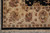 Corner detail with camel main border, guard stripes, black outer band and straight fringe
