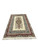 Ivory Kerman rug photographed at an angle showing rust red outer border and long fringe