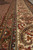 Border detail with ivory paisley vines, camel guard stripes and olive floral accents