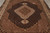 Angled floor view showing fish herati lattice filling the black center field and camel surround