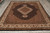 8'2" x 10'1" Mahi Tabriz design rug photographed from above in a warehouse showroom