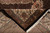 Folded corner showing pile depth, black selvage and ivory cotton fringe on wool silk rug