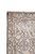 Corner detail showing ivory guard borders, pink overcast selvage and hand-knotted wool pile construction