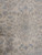 Detail of the 8 petal central medallion in pale blue and cream hand-knotted wool