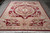 9'2" x 12' hand-knotted Savonnerie rug photographed from the fringed end on polished stone flooring