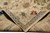 Folded corner revealing dense hand-knotted wool pile, cotton foundation edge and tightly woven back