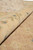 Rolled edge detail highlighting soft natural wool pile and even weave of this Peshawar rug