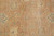 Detail of large ivory palmettes, cross rosettes and scrolling vines on the soft peach ground