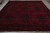 9'10" x 12'11" Afghan rug photographed flat with ivory fringe and layered tribal border visible