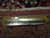 Ruler placed on the rug back to show knots per square inch and weave density