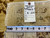 Rug back with inventory tag and tape measure confirming genuine hand woven Oriental rug construction